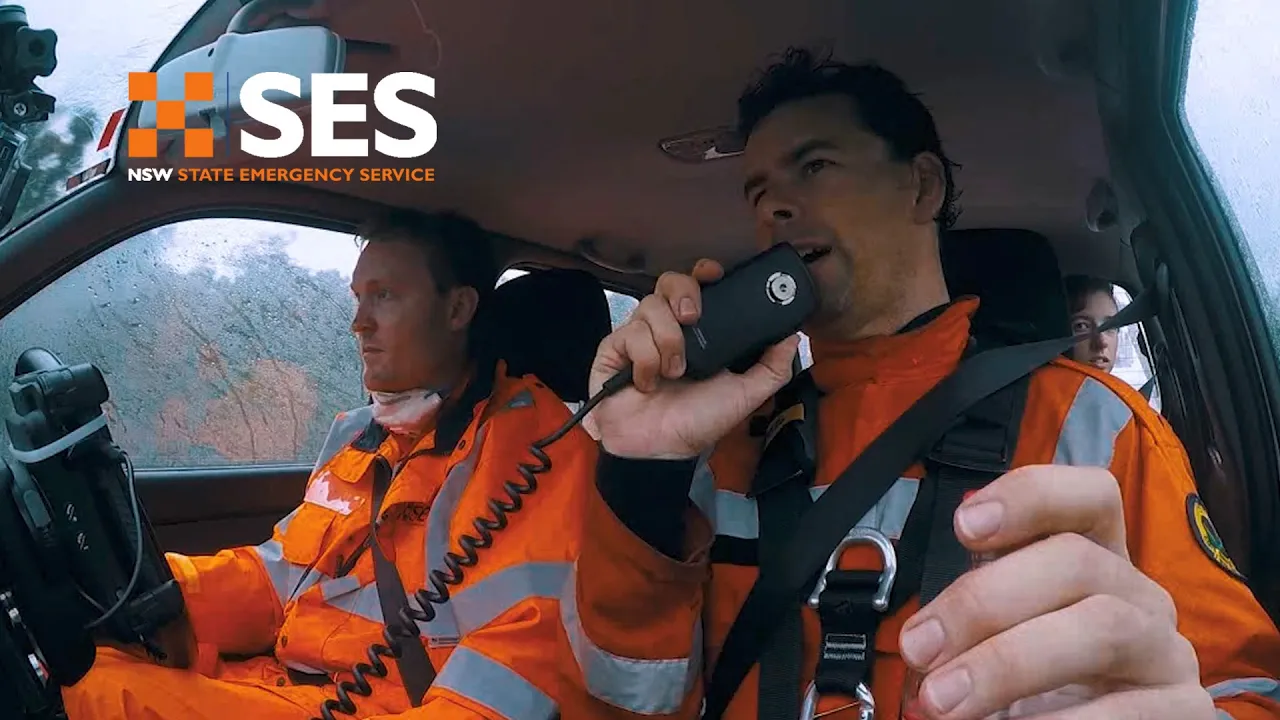 NSW SES personnel communicating by radio in an emergency vehicle